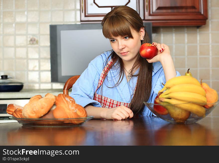 Young woman making a choice what to eat. Young woman making a choice what to eat.