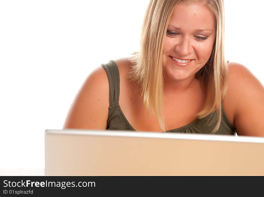 Smiling Beautiful Blonde Woman Using A Laptop. Smiling Beautiful Blonde Woman Using A Laptop.