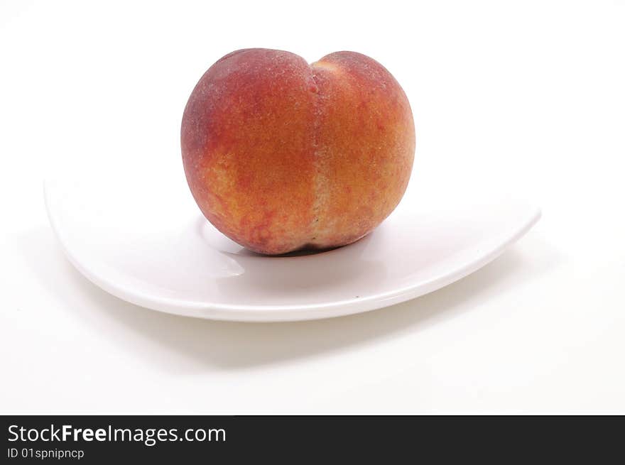 Fresh Peach On The Plate