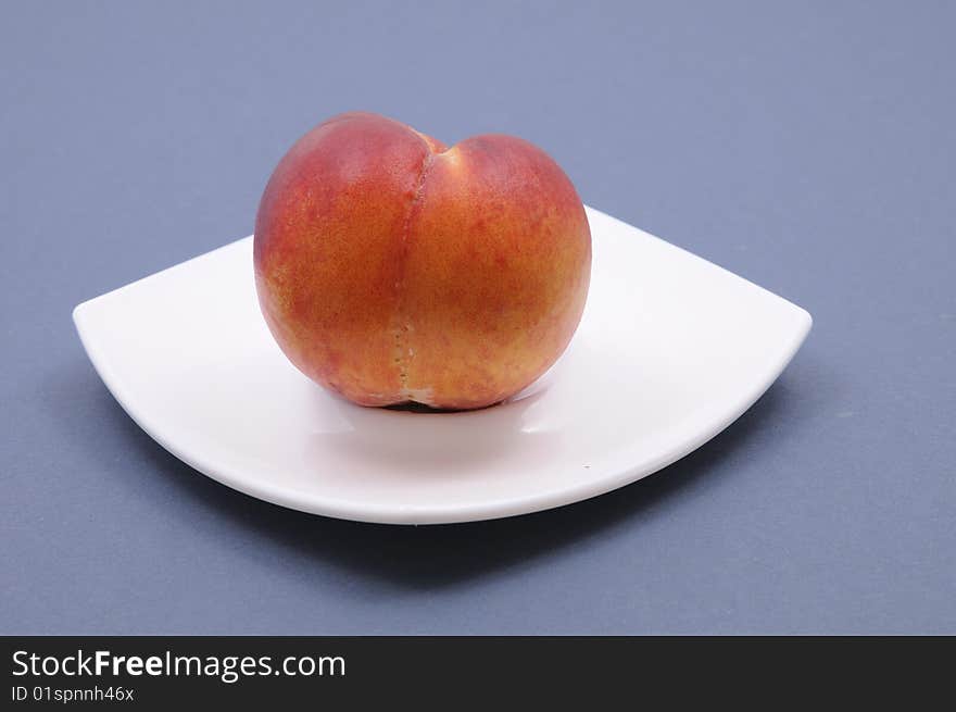 Fresh peach on the plate