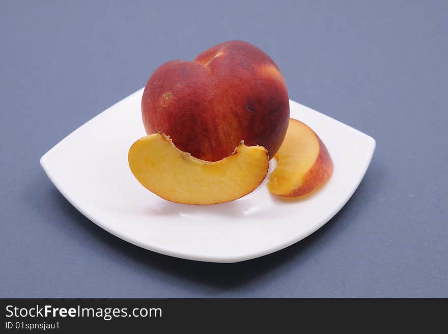 Fresh peach on the plate