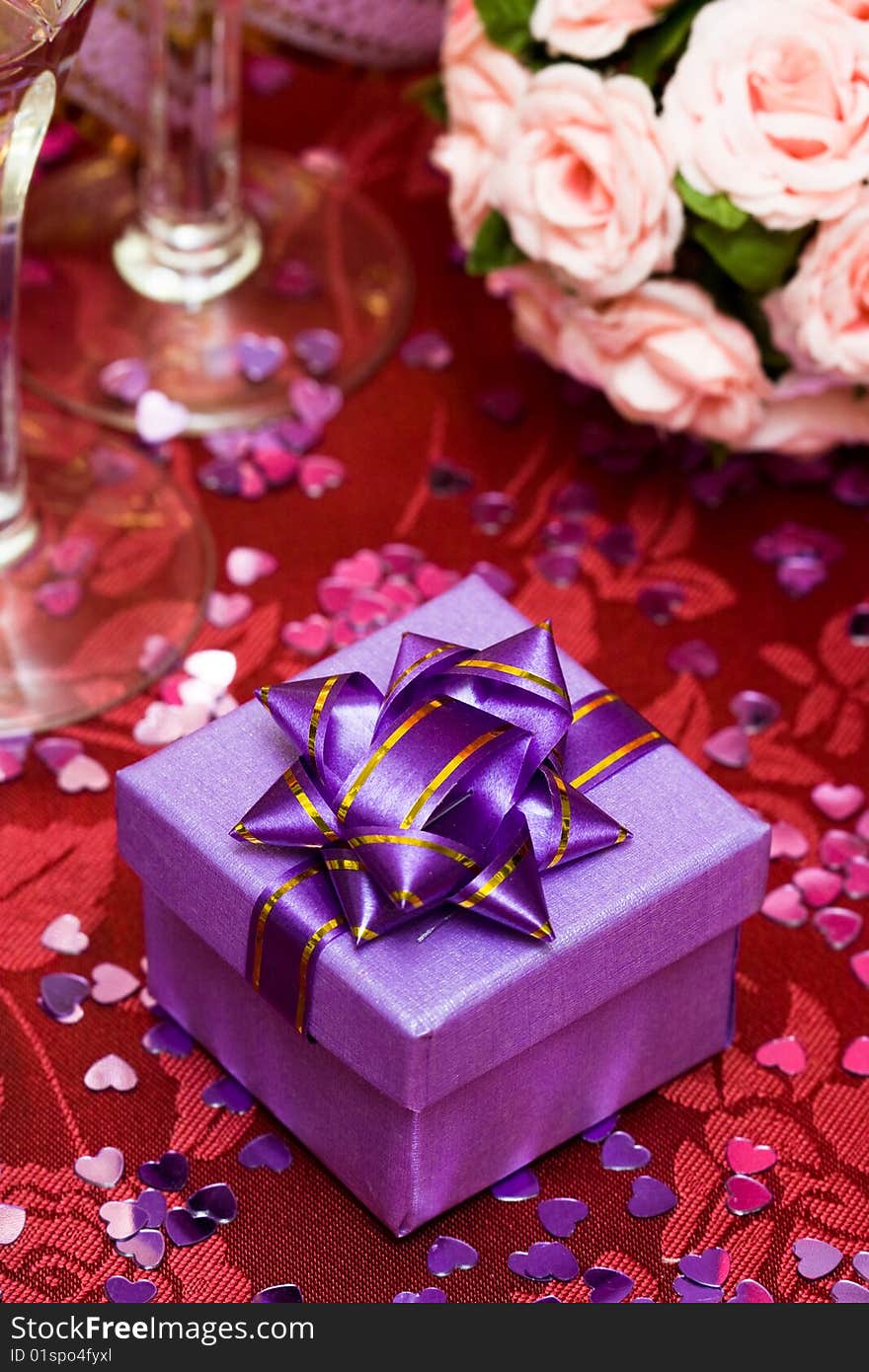 Gift box with bow and glass