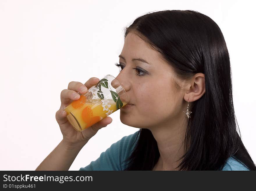 Young woman drinking glass of orange juice. Young woman drinking glass of orange juice