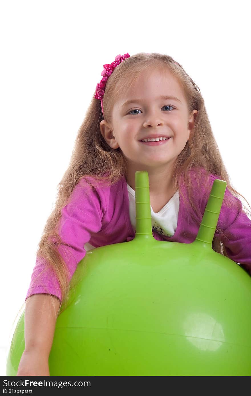 Little girl and big green ball on white background