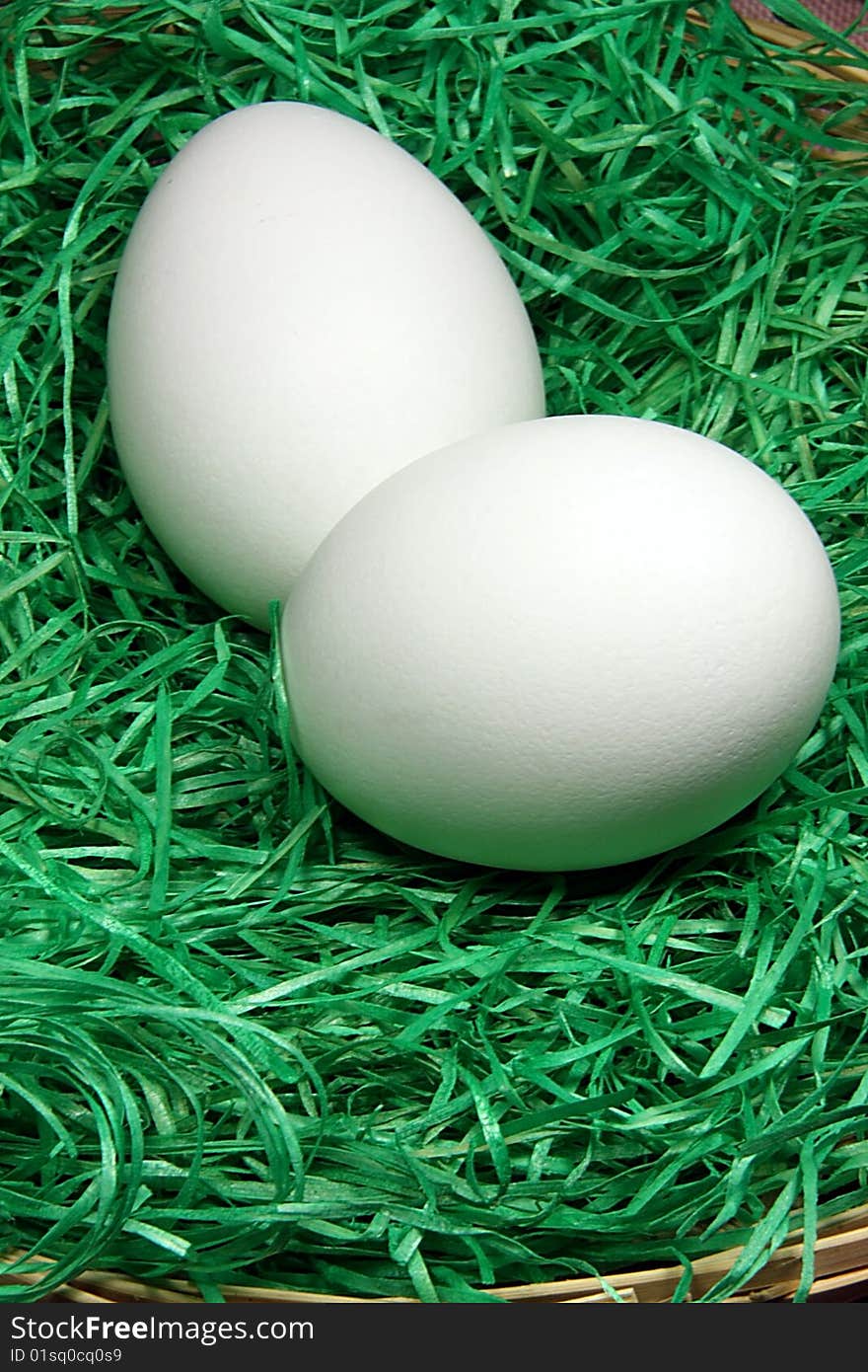 two white  easter egg,two eggs in the grass ,