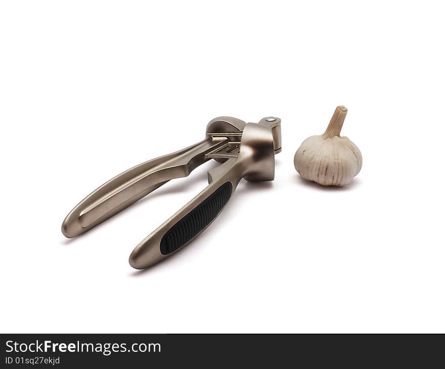 Garlic and press on white background with clipping path