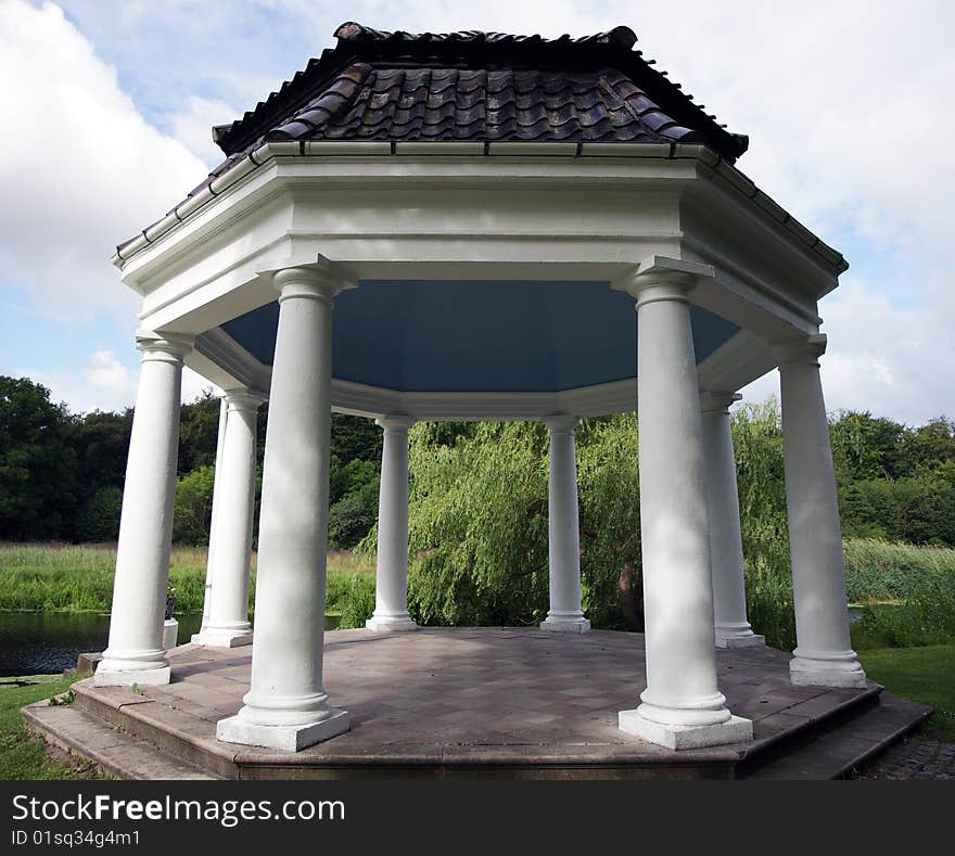 A gazebo alongside a small stream