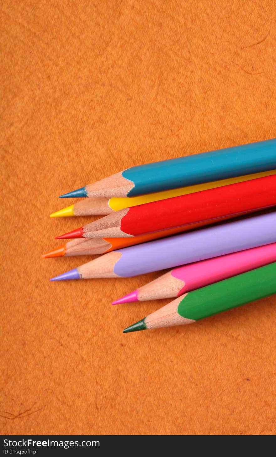 Multicolored pencils with handmade paper