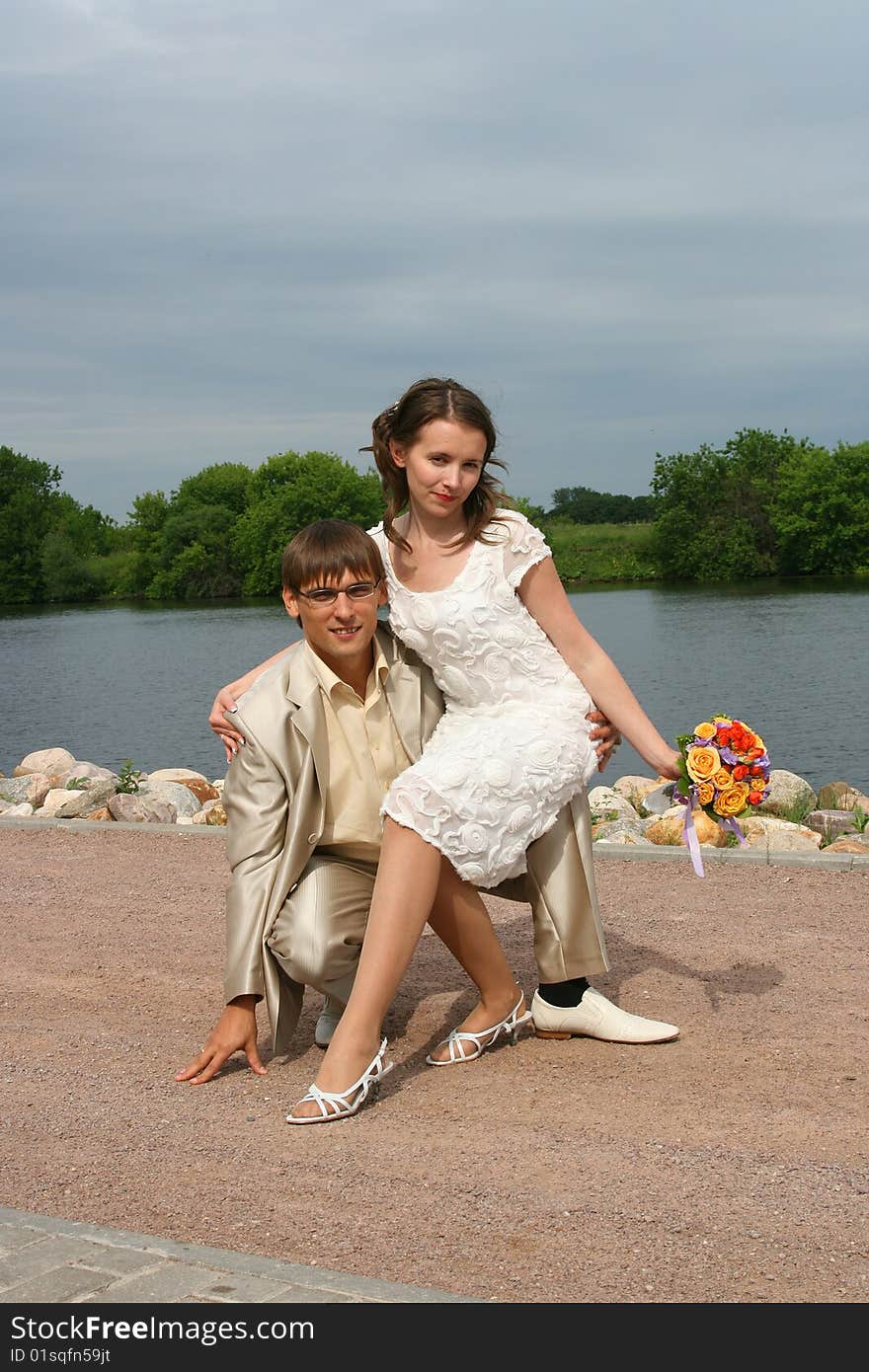 Newly-married couple on wedding walk in the cool afternoon