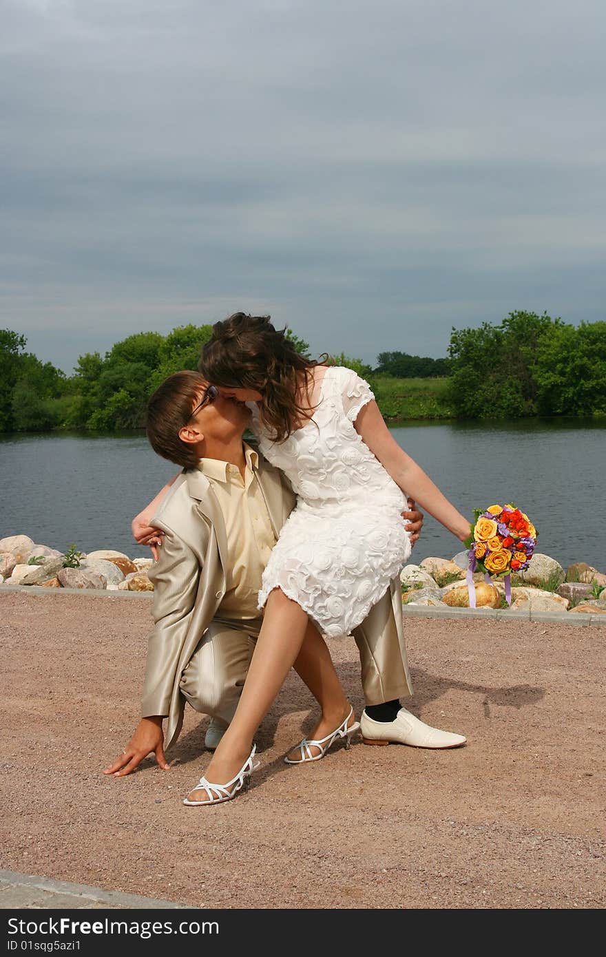 Newly-married couple on wedding walk in the cool afternoon. Newly-married couple on wedding walk in the cool afternoon