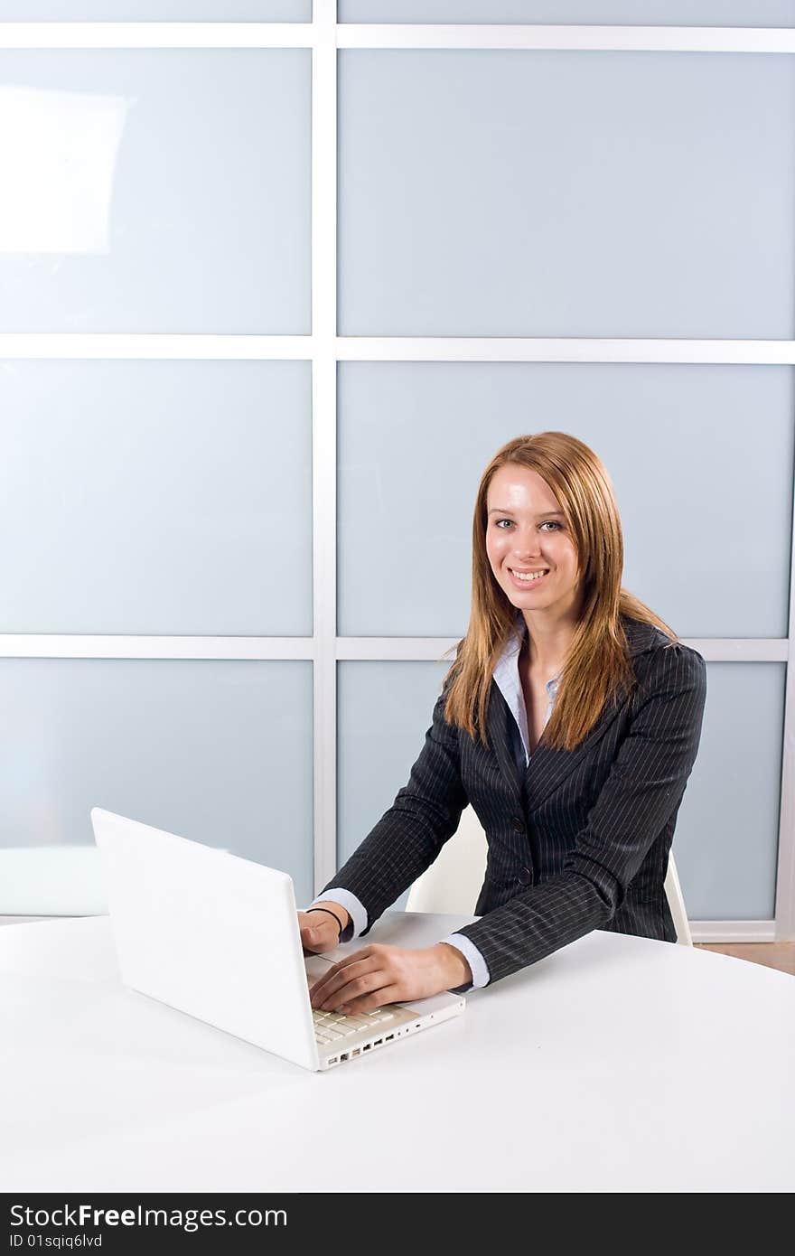 Business woman laptop in modern office