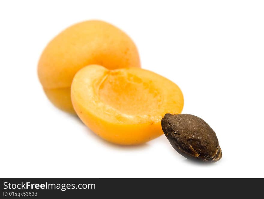 Ripe apricot unpitted on a white background. Ripe apricot unpitted on a white background