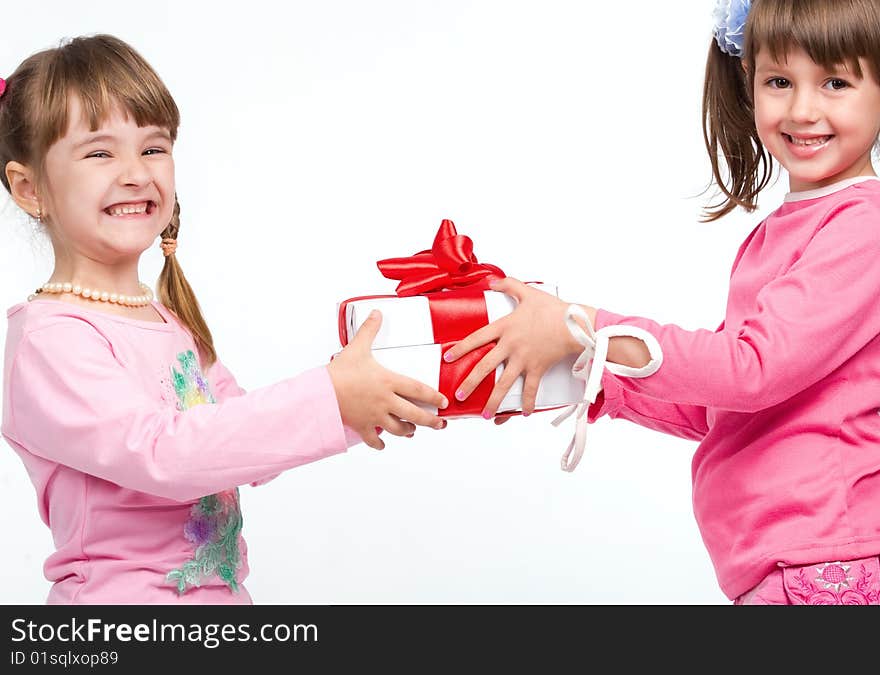 Little girls holding gift boxes