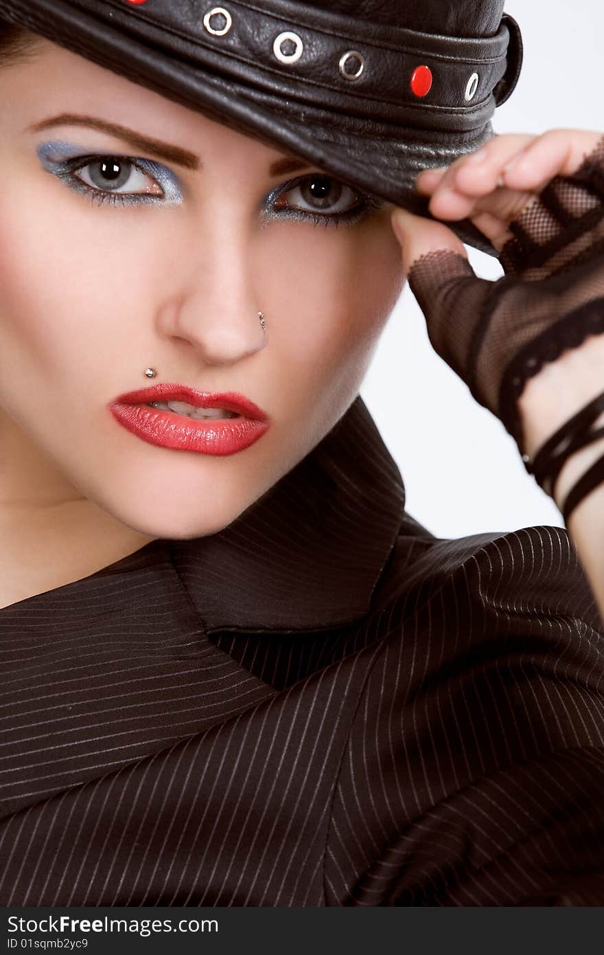 Young fashionable model with black hat