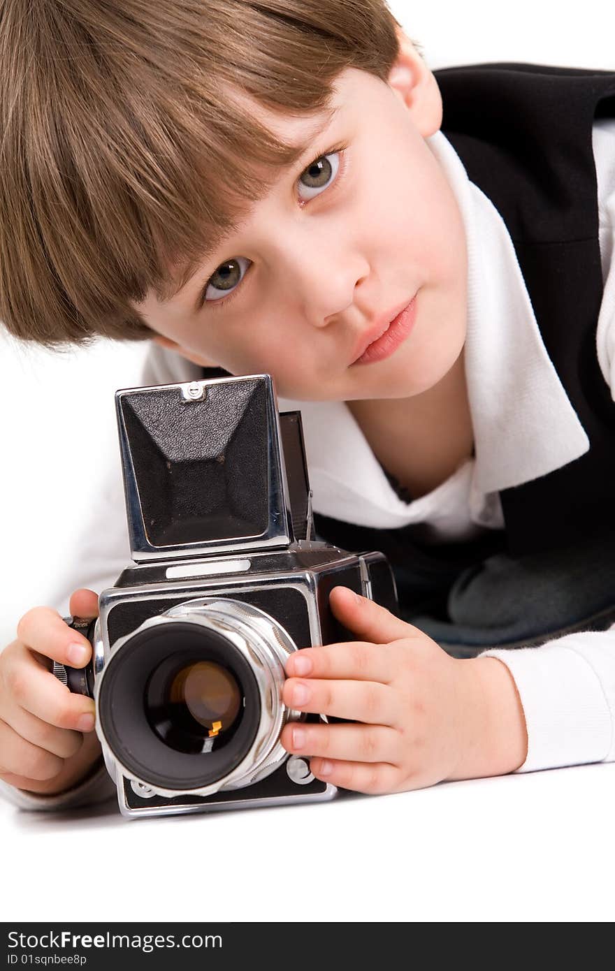 Attractive little boy with photo camera over white. Attractive little boy with photo camera over white