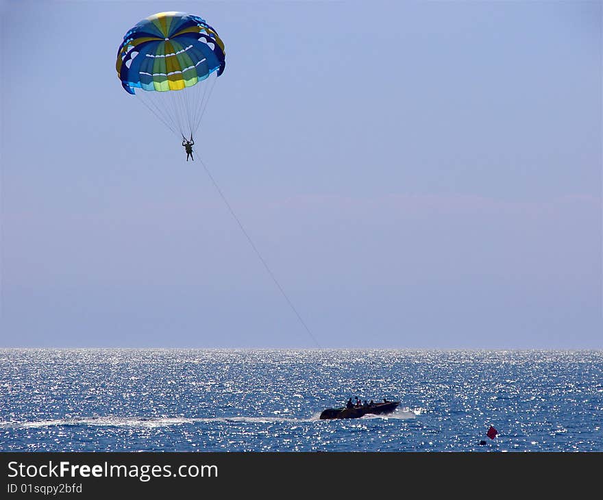 Woman flying on a parachute