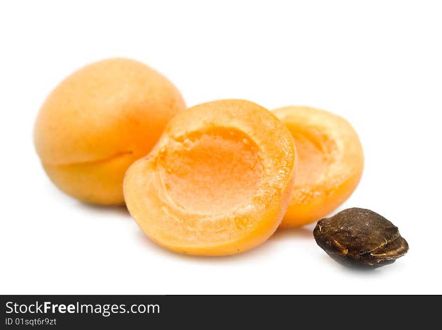 Ripe apricot unpitted on a white background. Ripe apricot unpitted on a white background