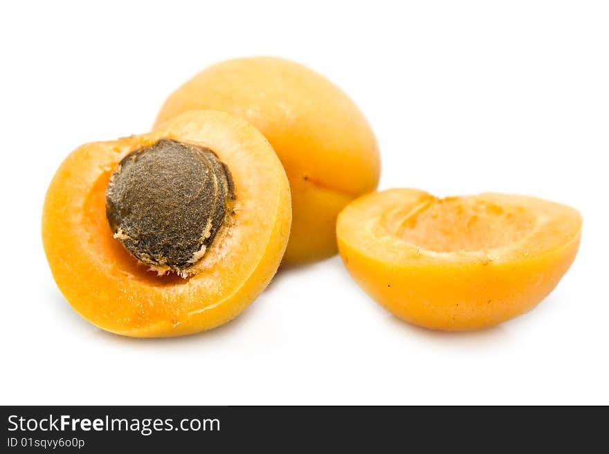 Ripe apricot unpitted on a white background. Ripe apricot unpitted on a white background