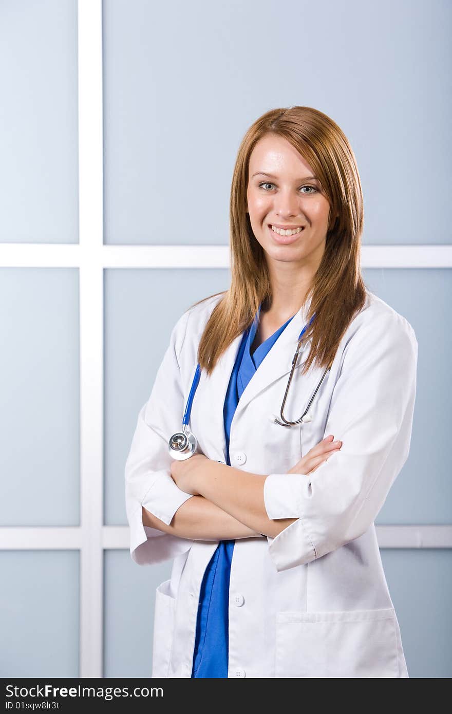 Female doctor arms crossed in a modern office