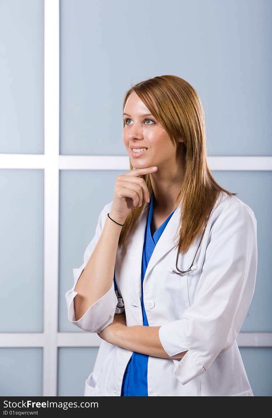 Young female doctor standing in a modern office