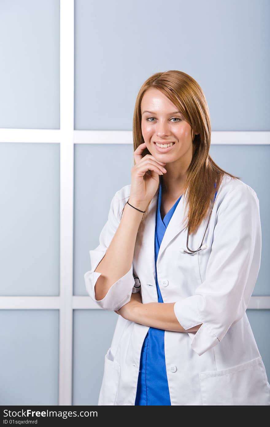 Young female doctor standing in a modern office