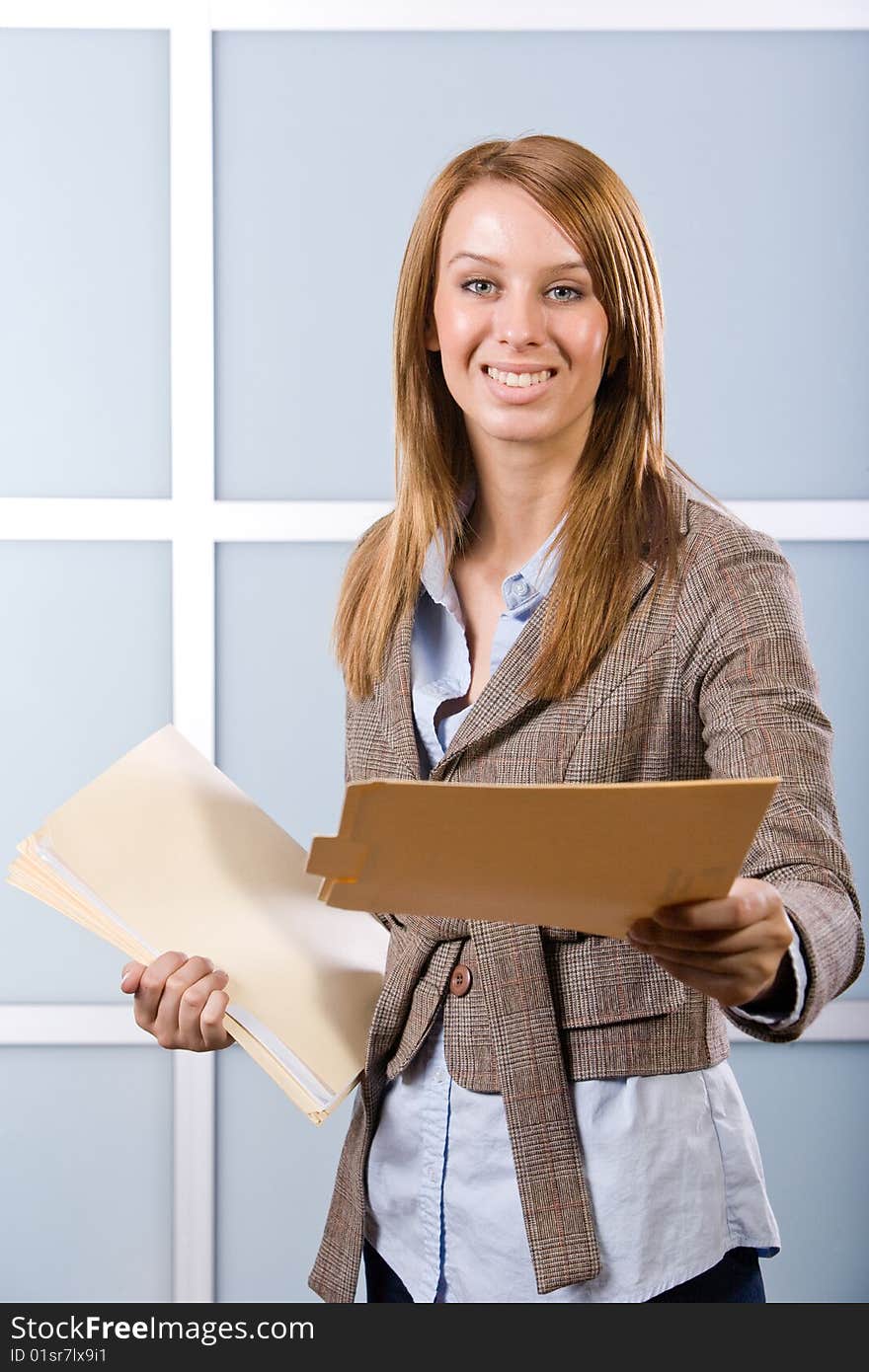 Business woman holding legal documents