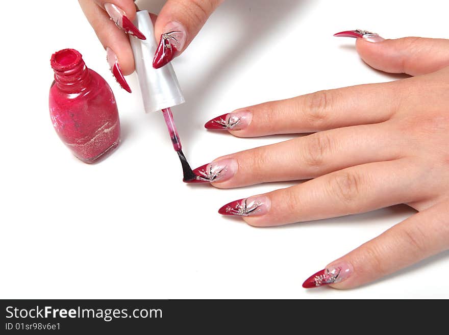 Woman applying red nail polish. Woman applying red nail polish