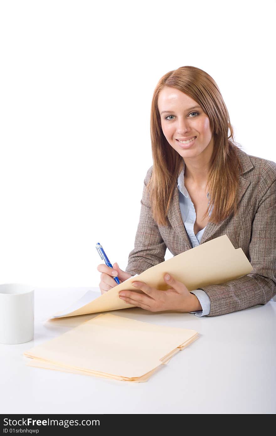 Business Woman Writing notes at desk