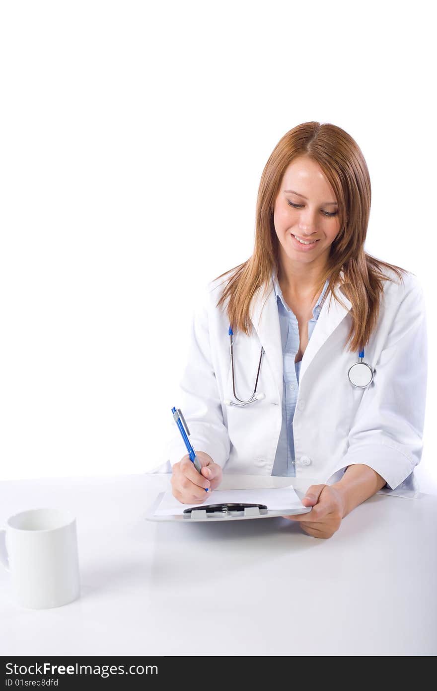 Female doctor in a modern office drinking coffee