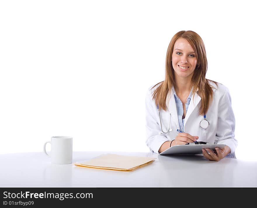 Female doctor in a modern office drinking coffee