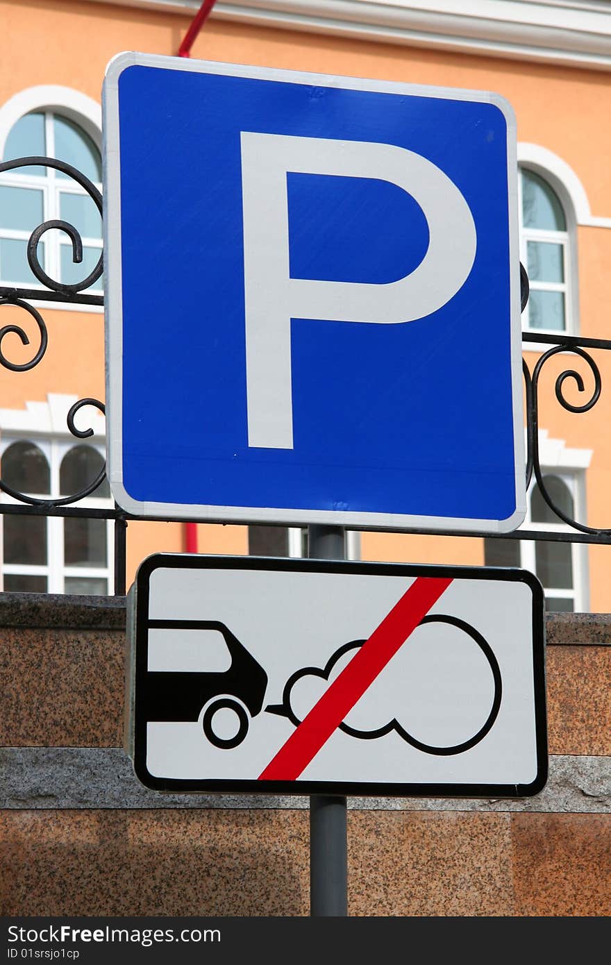 Two traffic signs in city street