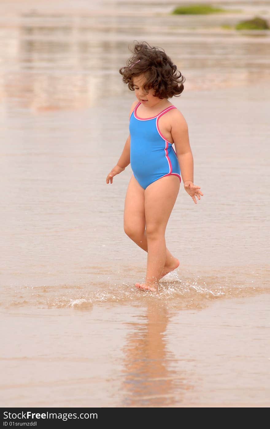 Cute Little Girl On The Beach