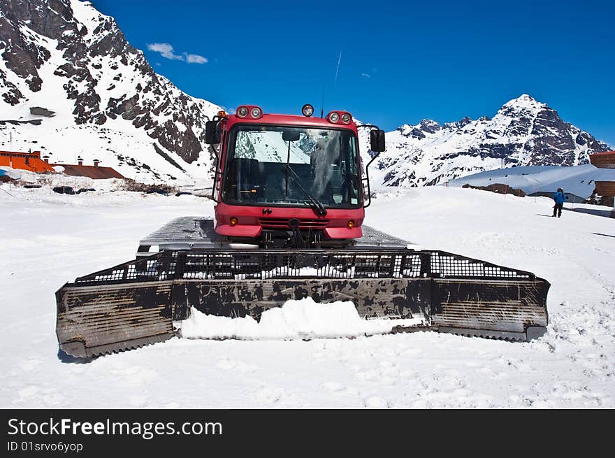 Red snowcat front stay on snow.