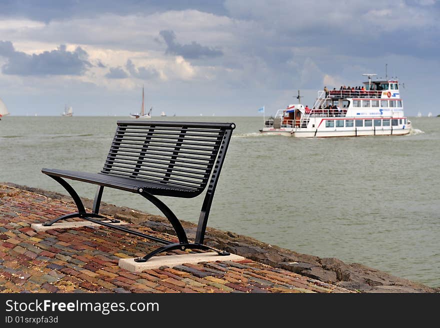 A bench and the boat in the Netherlands