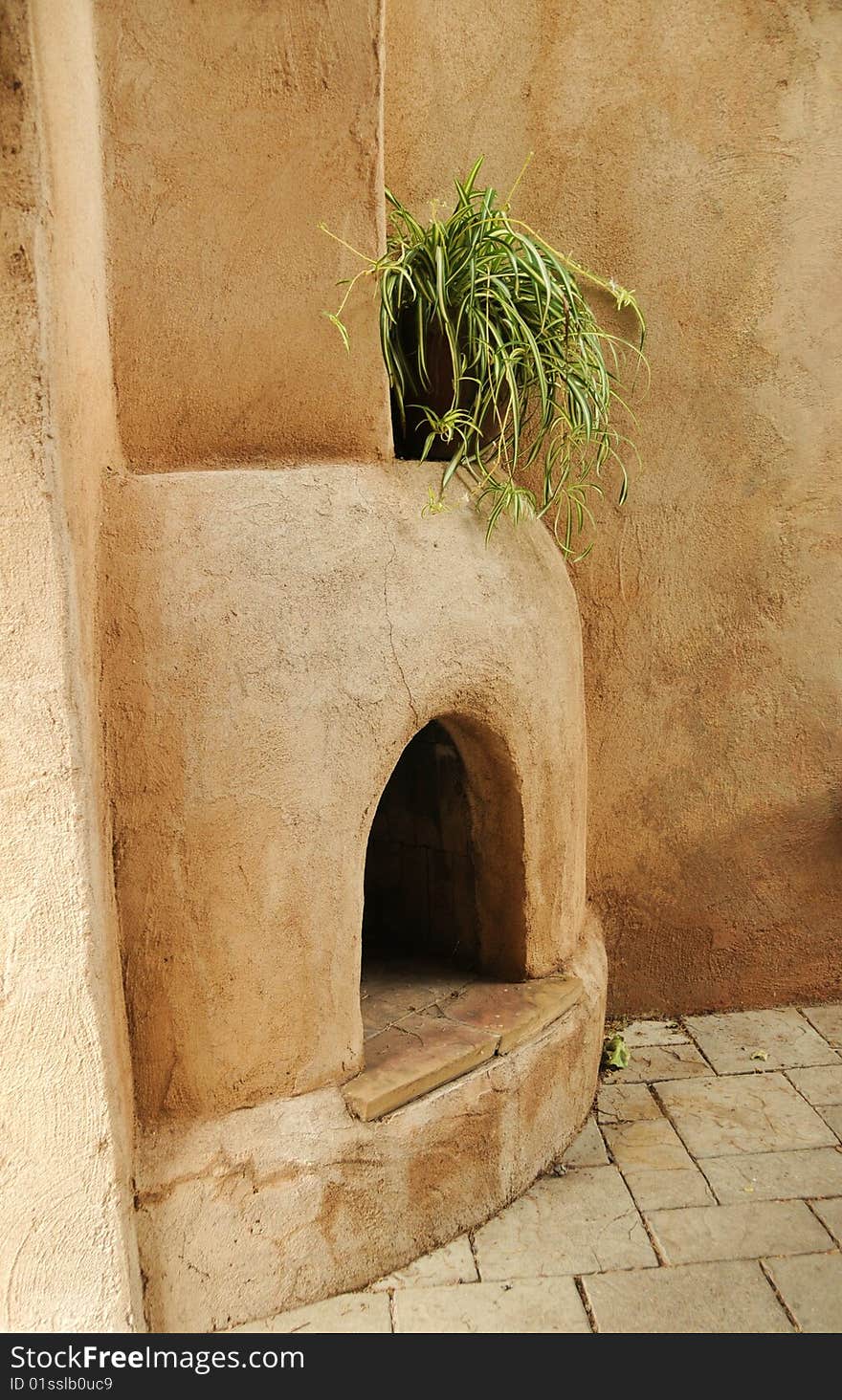 Traditional 0utdoor adobe fireplace found in Arizona