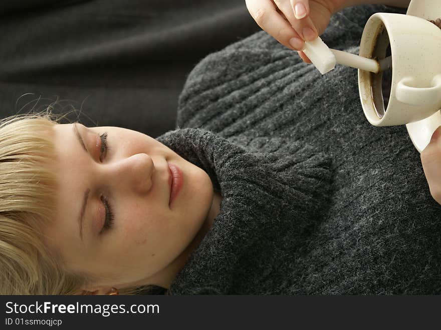 Beautiful young girl with a cup of hot coffee drink. Beautiful young girl with a cup of hot coffee drink