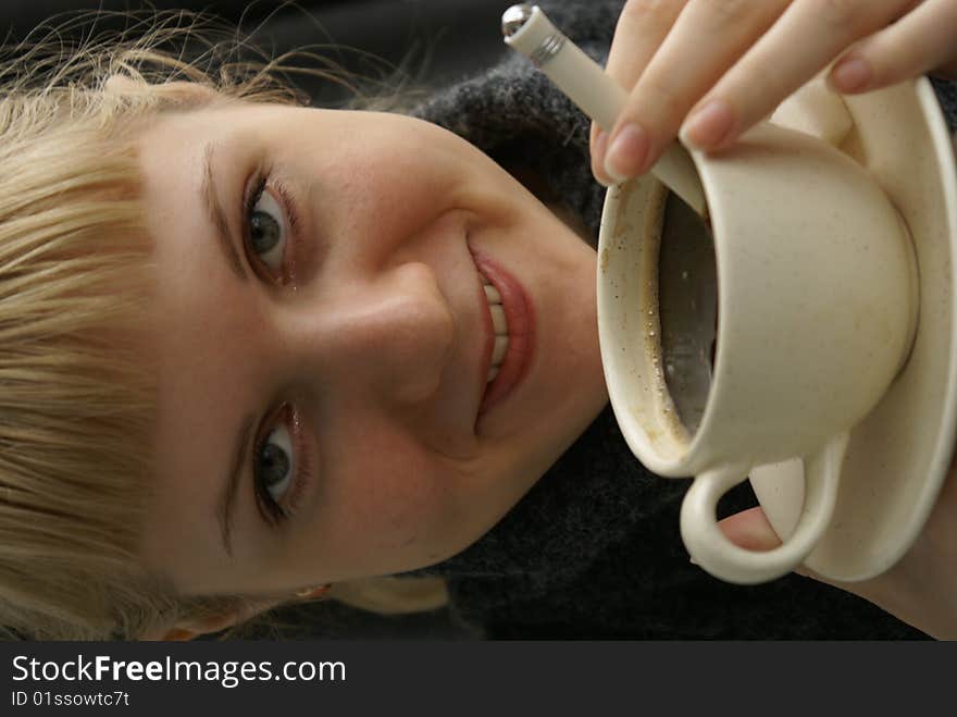 Beautiful young girl with a cup of hot coffee drink. Beautiful young girl with a cup of hot coffee drink