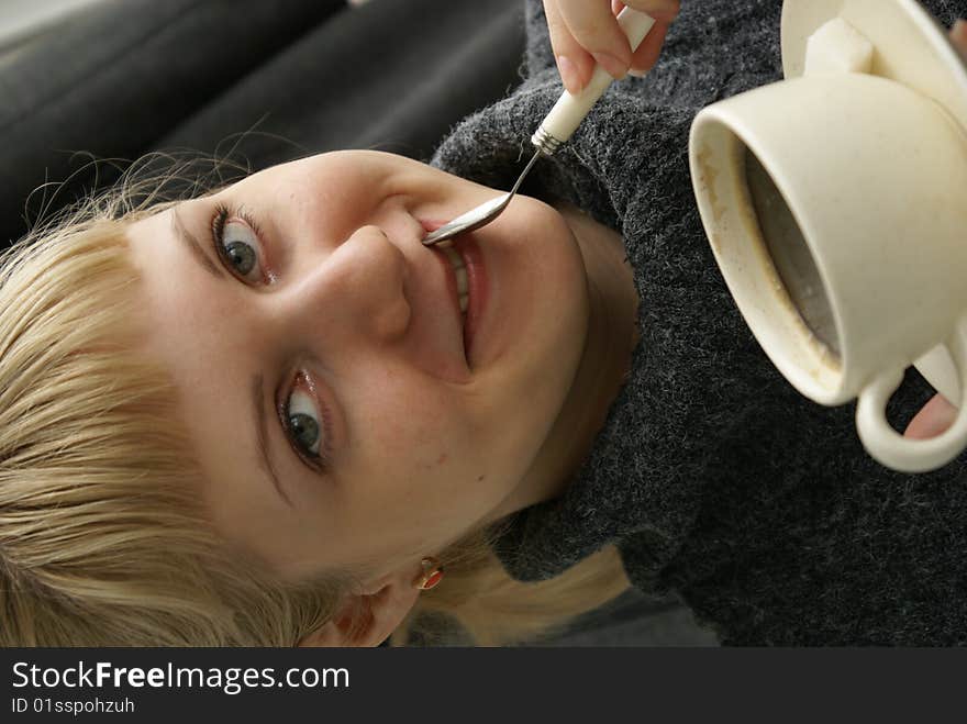 Beautiful young girl with a cup of hot coffee drink. Beautiful young girl with a cup of hot coffee drink