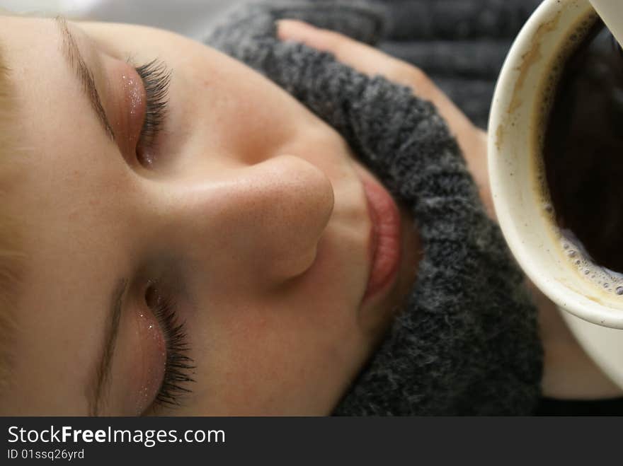 Beautiful young girl with a cup of hot coffee drink. Beautiful young girl with a cup of hot coffee drink