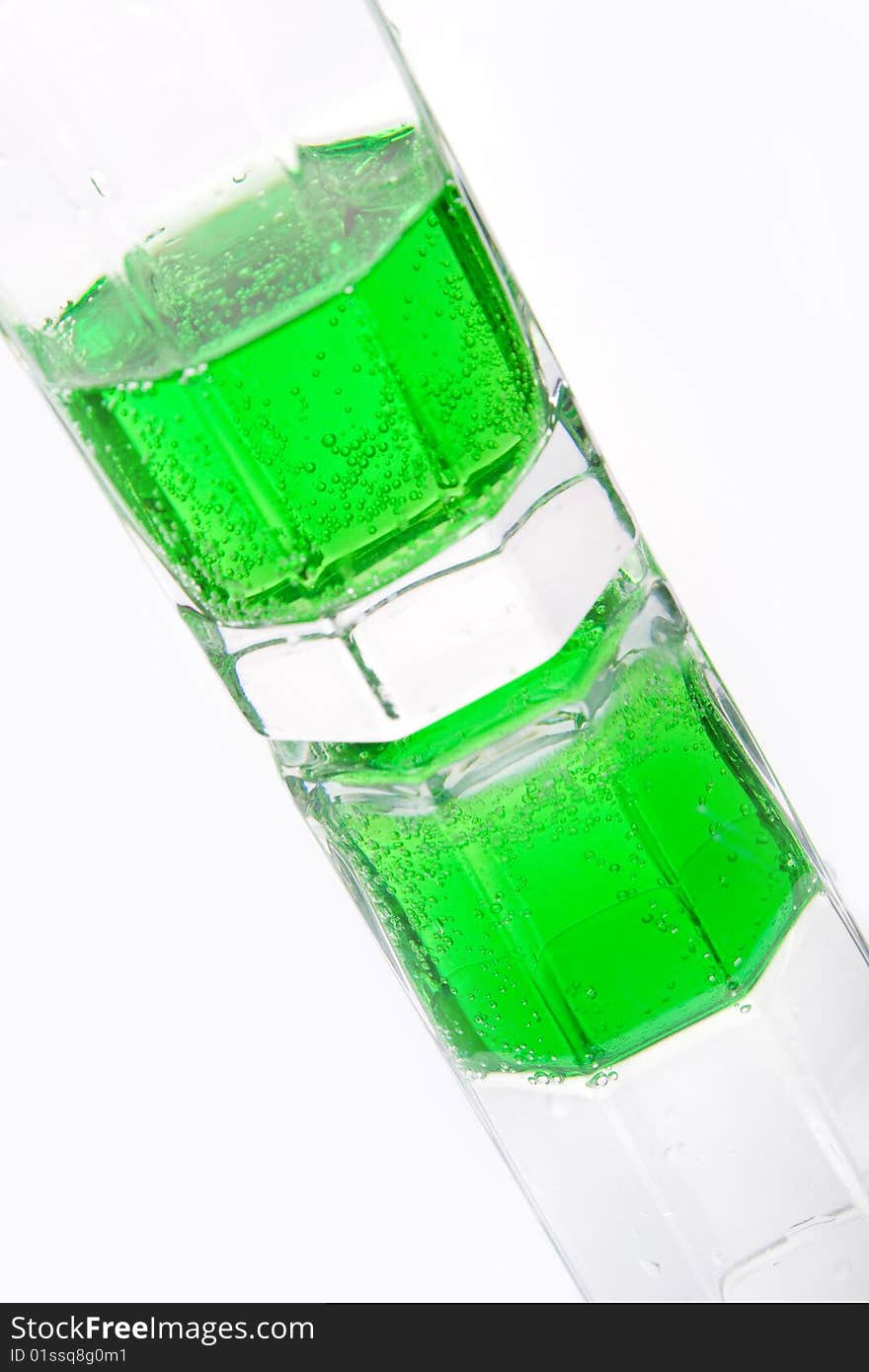 Green soda in a glass