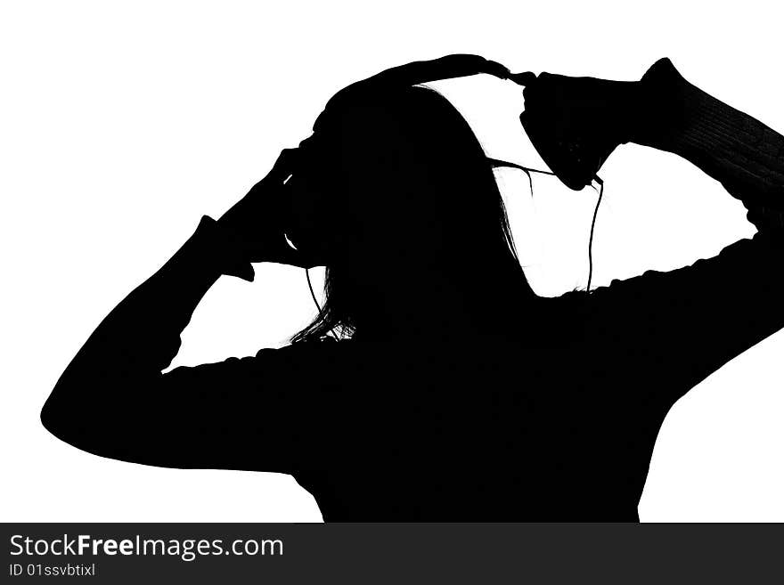 Woman listening loud music over white background wearing green t-shirt