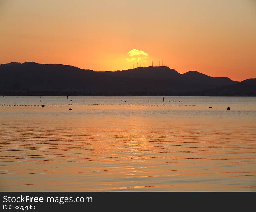 Sunset Over Land And Sea