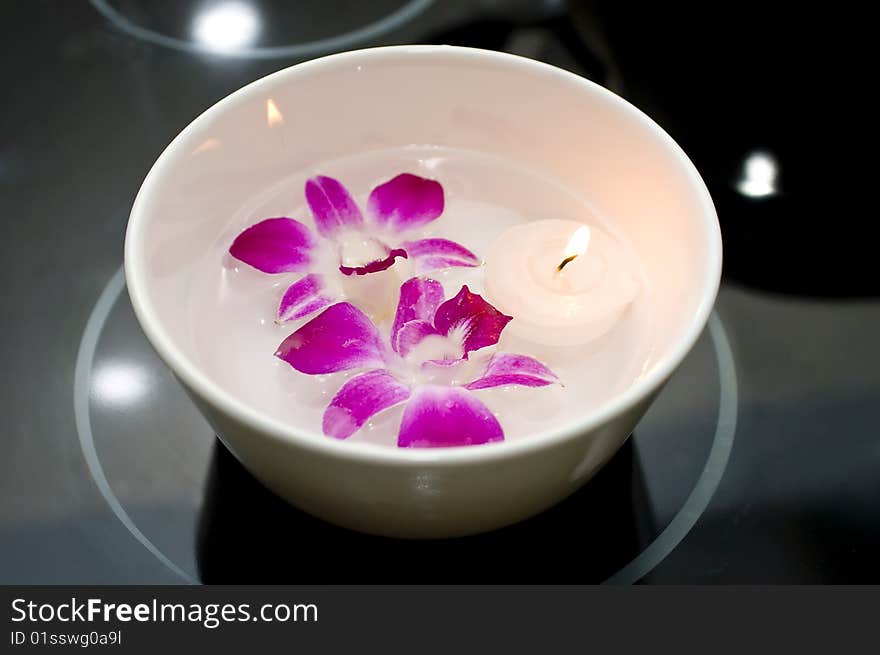 Bowl Of Water With Orchids And Floating Candle