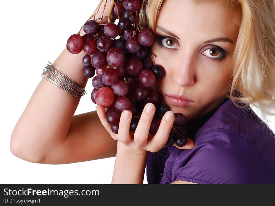 Woman with bunch of grapes