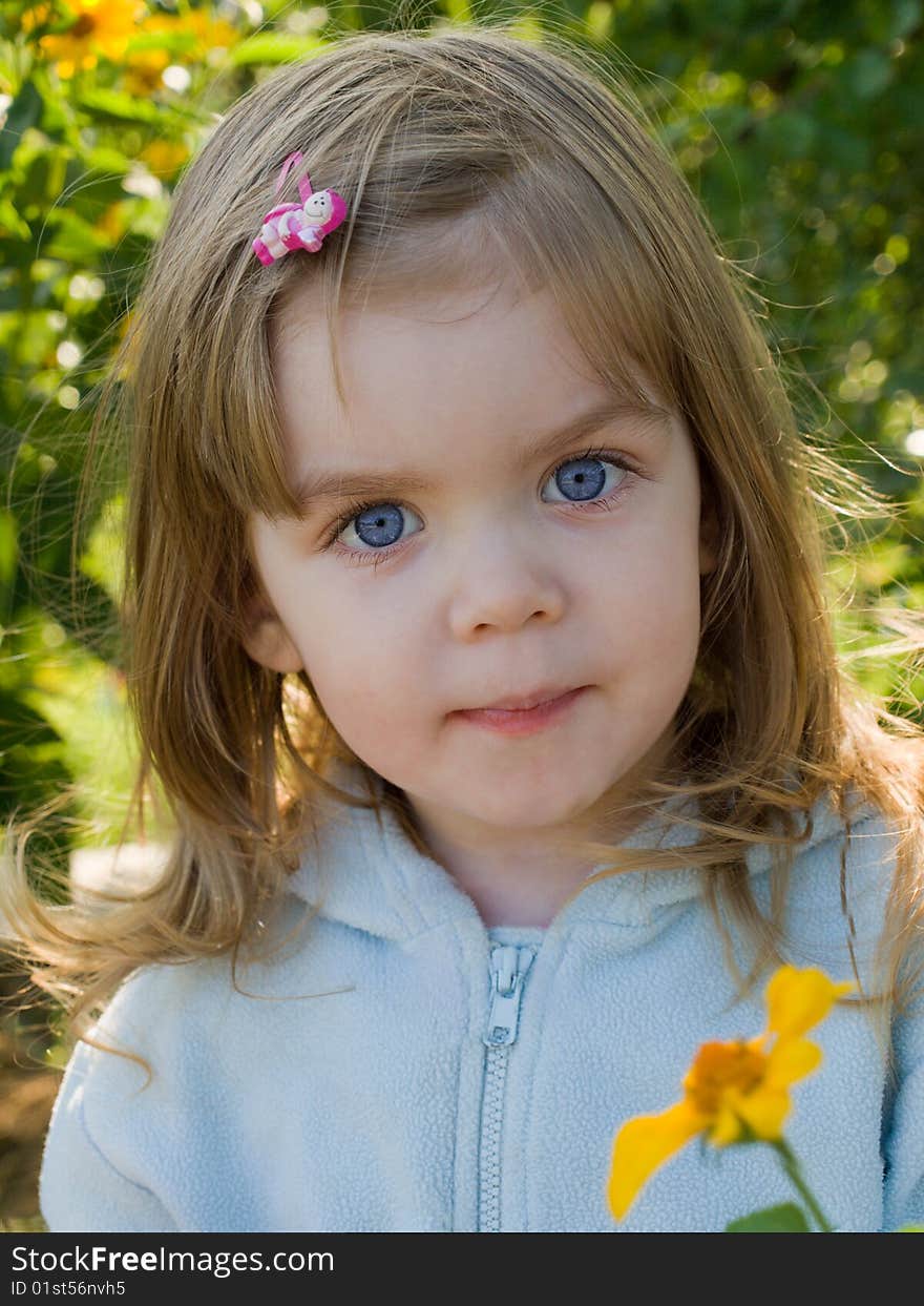 Little girl in a blue sweater