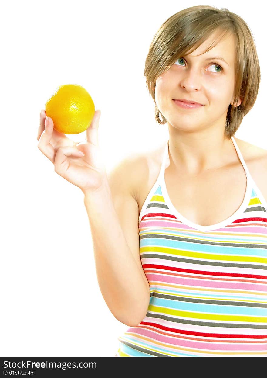 Portrait of a cute Caucasian blond girl with a nice colorful striped dress who is smiling and she is holding a fresh orange in her hand. Isolated on white. Portrait of a cute Caucasian blond girl with a nice colorful striped dress who is smiling and she is holding a fresh orange in her hand. Isolated on white.