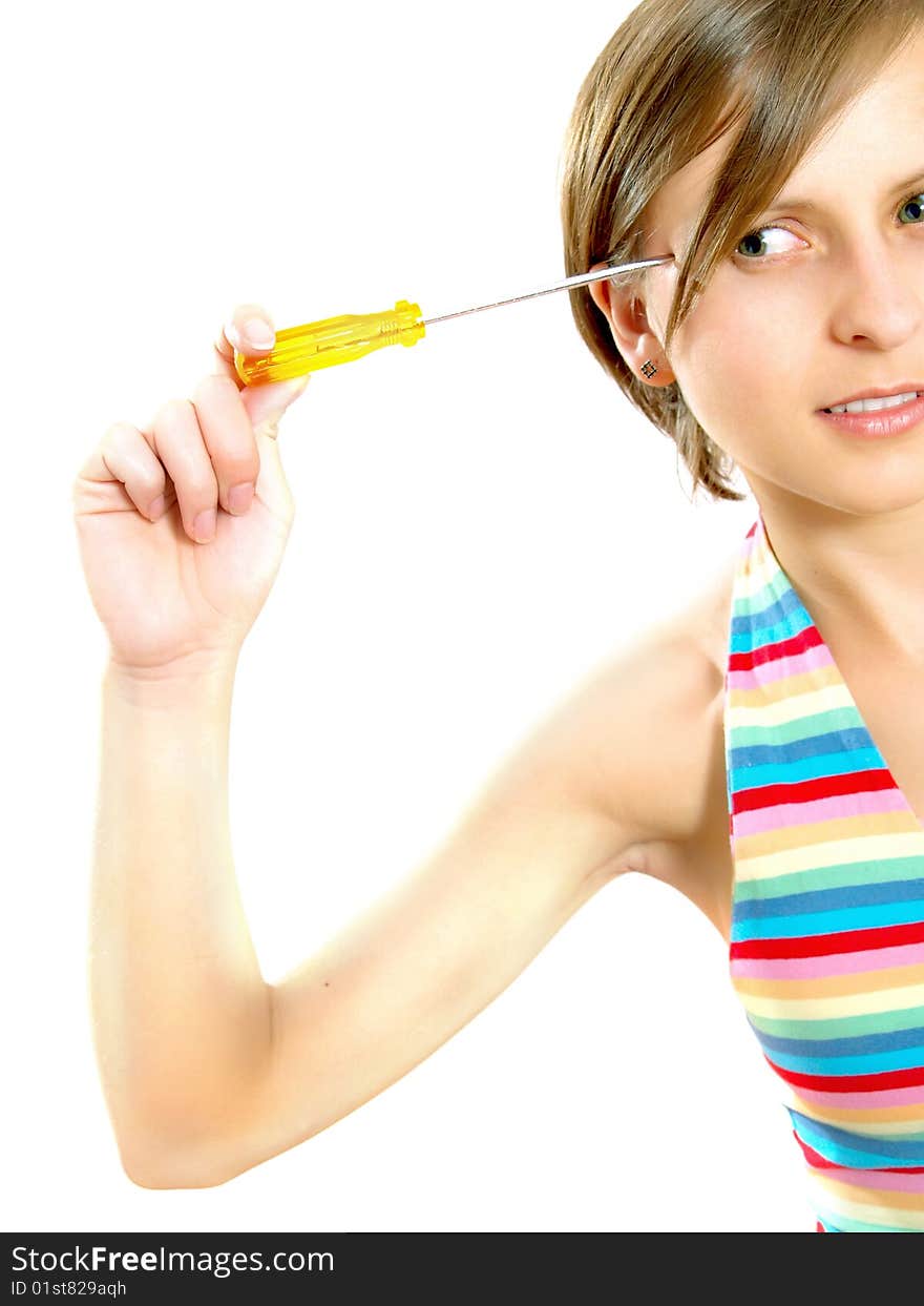 Portrait of a cute Caucasian blond girl with a nice colorful striped summer dress who is thinking and she is holding a screwdriver to her head. Isolated on white. Portrait of a cute Caucasian blond girl with a nice colorful striped summer dress who is thinking and she is holding a screwdriver to her head. Isolated on white.