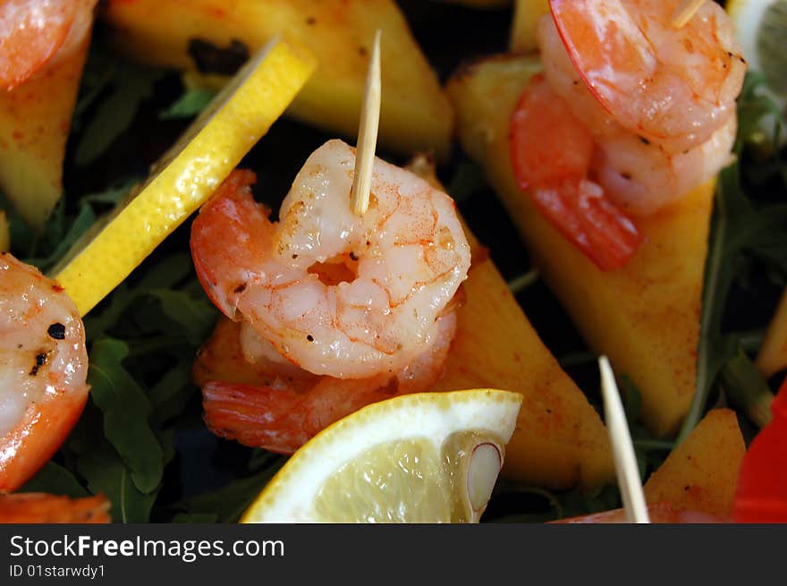 Close-up of sea food made of shrimps and lemon