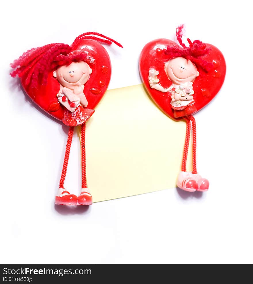 Two shape of heart toys of boy and girl with paper. Two shape of heart toys of boy and girl with paper