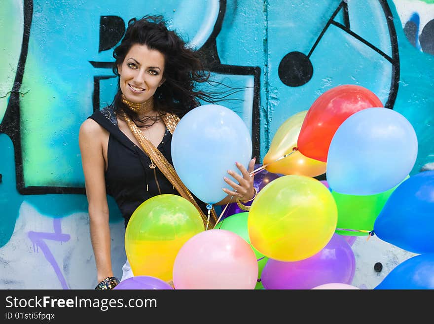 Happy woman with colorful balloons